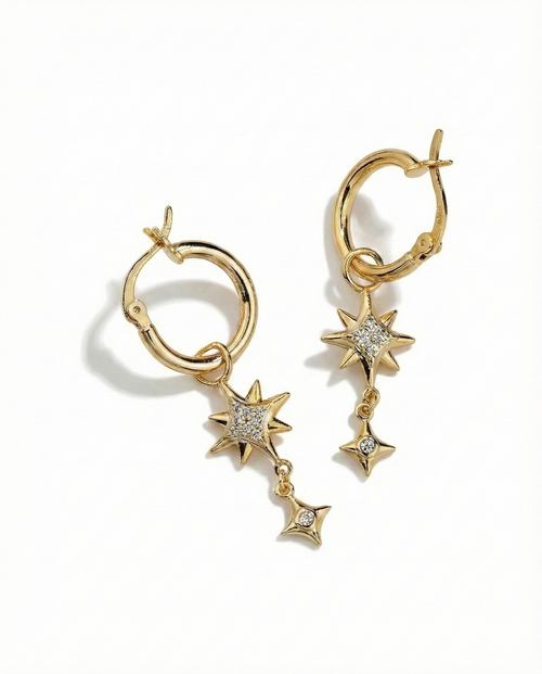 Gold hoop earrings with star-shaped charms on a white background