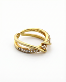Gold ring with diamond accents on a white background