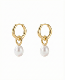 Gold hoop earrings with pearl charms on a white background