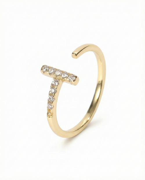 Gold ring with small diamonds on a white background